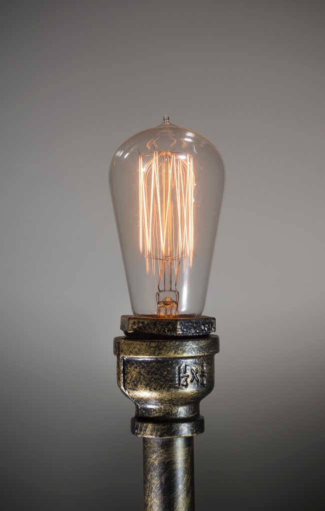 Exposed light bulb with industrial metal finish
